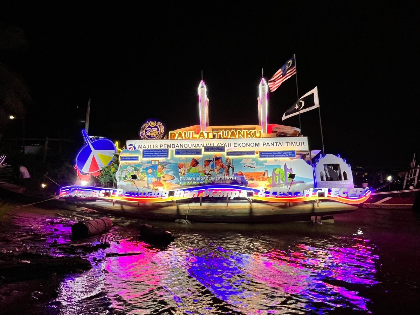 Illuminated boat float at night